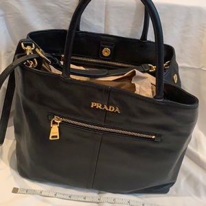 Prada black handbag.  Somewhat well used but no scuffs on bottom (see pic)